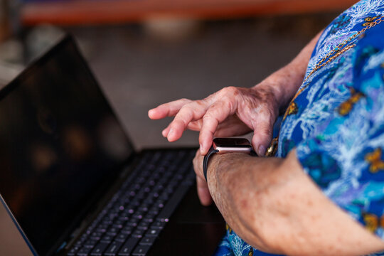 senior person using smartwatch technology