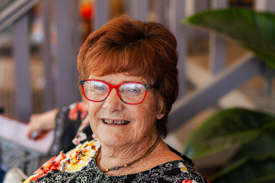 Headshot of senior woman close up wearing glasses