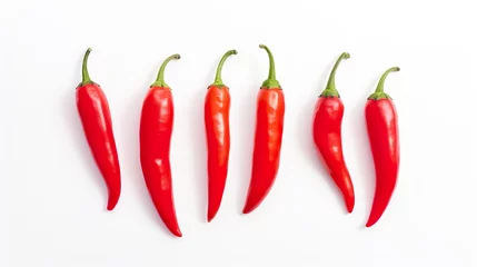 Fotobehang Vibrant Red Chili Peppers Lined Up on a White Background © MariahPasha