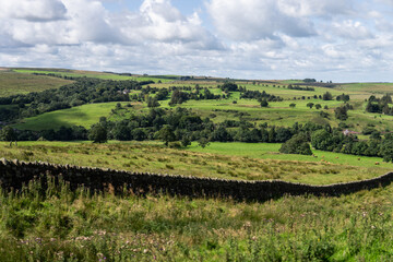 Fototapeta na wymiar looking across the rolling countryside along Hadrian's Wall Path near Greenhead, Northumberland, UK
