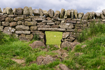 an old stone farmhouse along Hadrian's Wall Path near Once Brewed, Northumberland, UK