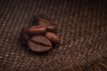 roasted coffee beans on the background of a bag