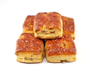 Scones with raisins on white background. It's a traditional british and irish baked sweet.