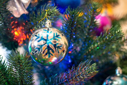 Colorful balls decorate the Christmas tree. Christmas and New Year's card