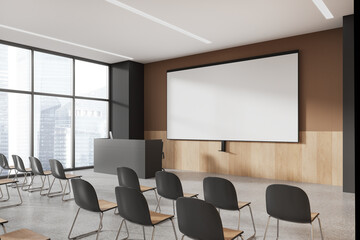 Beige and gray lecture hall corner with projection screen