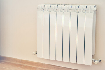 Radiator heating in the apartment. Adjust the heating system, preparing the apartment for the new cold autumn or winter season with space to copy. High quality photo