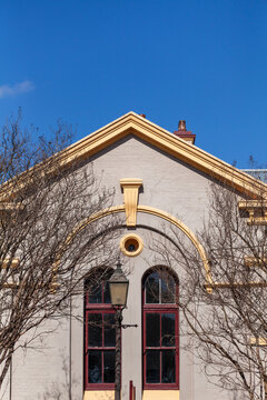 Architecture of old sunlit building in Morpeth suburb of Maitland under blue sky
