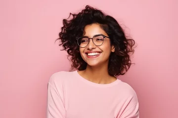 Poster Beautiful young Indian woman smiling wearing glasses © PRASANNAPIX