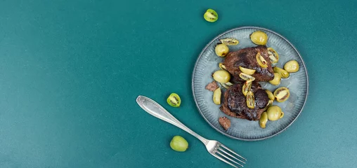 Keuken spatwand met foto Grilled ostrich steak with kiwi berries © nikolaydonetsk
