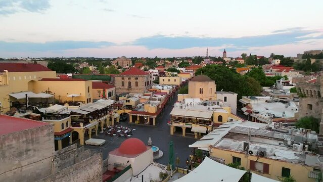 Rhodes old town houses, Mosque of Suleiman and surrounding fortifications at sunrise, Greece,  Aerial view 
