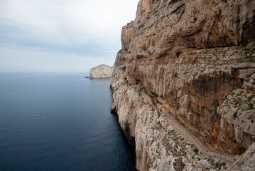 Fototapeta na wymiar Access to Neptune Grotto Staircase - Sardinia - Italy
