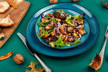Mushroom salad with onions and walnuts.