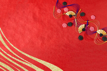 日本の正月イメージ------波型水引と梅型水引と扇と金色の波の合成（赤い和紙の背景）