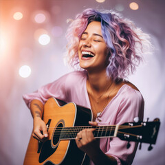 Obraz premium Portrait of happy young woman playing guitar on blurred lights background.