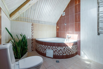 A spacious bathroom with heated floors, a separate bathroom, shower, double shell and windows
