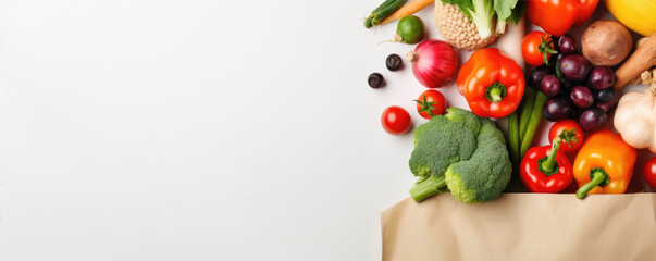 healthy raw food  Healthy vegetarian food in paper bag vegetables and fruits on white background. panorama photo