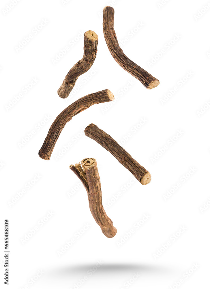 Wall mural Sticks of liquorice root floating on white background.