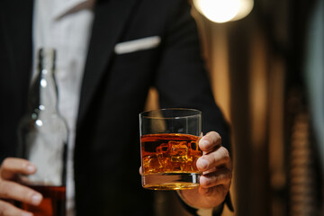 Businessman wearing a suit whiskey glass of liquor.Businessman wearing a suit whiskey glass of liquor.