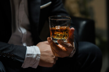 Businessman wearing a suit whiskey glass of liquor.Businessman wearing a suit whiskey glass of liquor.