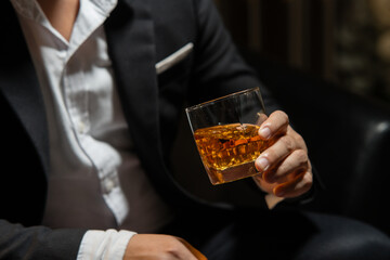 Businessman wearing a suit whiskey glass of liquor.Businessman wearing a suit whiskey glass of liquor.