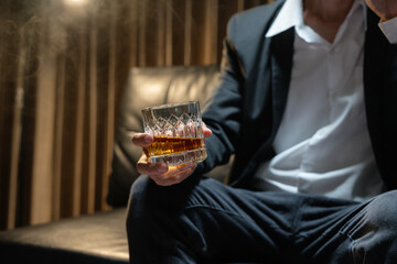 Businessman wearing a suit whiskey glass of liquor.Businessman wearing a suit whiskey glass of liquor.