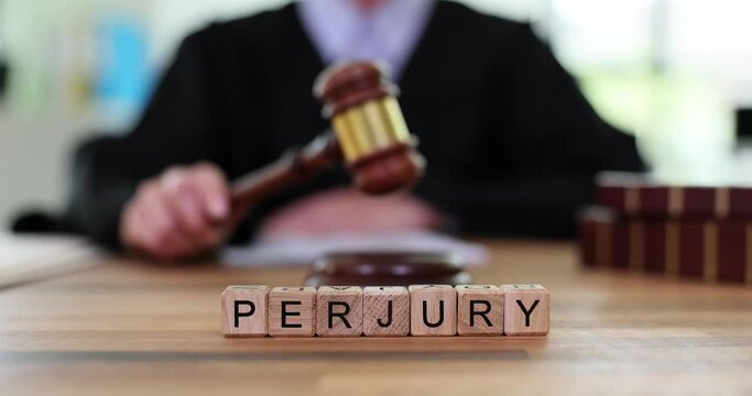 Word is perjury and judge bangs gavel in court. Law and court and witness