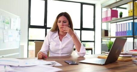 Upset businesswoman reading bad news financial report in paper letter and feeling disappointed. Businesswoman notice of debt and failed business deal sitting at office desk