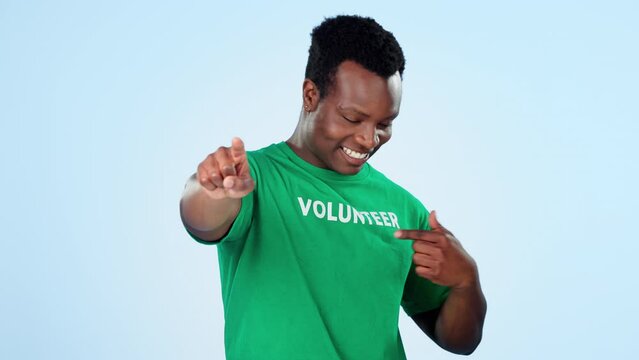 Pointing, black man and volunteer with welcome for charity, community work and help. Happy, face portrait and African person with a gesture and communication for volunteering on a studio background