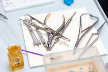 Close-up of medical dental instruments lying on table. Concept of dentistry