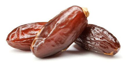 Three ripe dates isolated on a white background. Full clipping path. Dates .