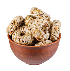 Clay cup with kozinaki isolated on a white background. Round kozinaki.