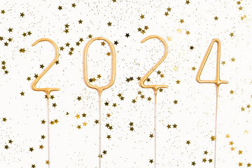 number 2024 and gold glitter on white isolated background. the concept of New Year, Christmas,...