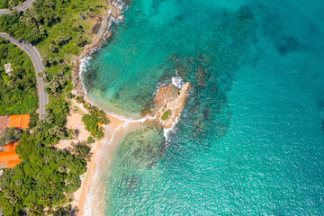 .aerial view around mini isle in front Ya Nui beach. .The clear green sea water can be seen through the sea..green sea white sand beach 4K video for creative nature and travel concept.