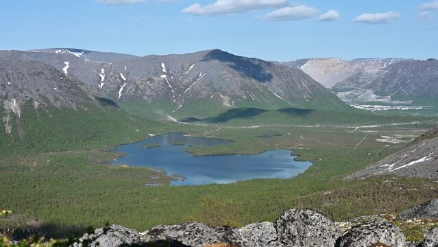 View of a beautiful lake surrounded by the Khibiny Mountains, located beyond the Arctic Circle in northern Russia
