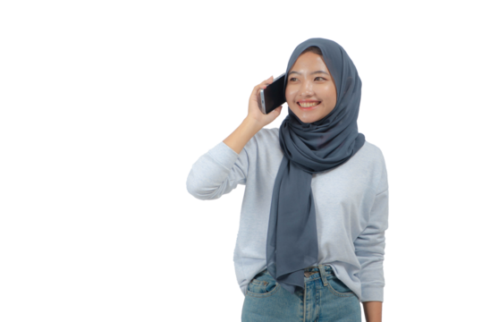Young Asian woman in hijab holding a mobile phone and pose like making a call