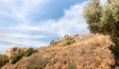Bottom view of hill with ruins of fortress walls of the medieval fortress of Nimrod - Qalaat al-Subeiba, located near the border with Syria and Lebanon on the Golan Heights, in northern Israel