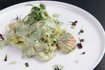 Pasta with salmon in a plate.