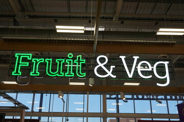 Fruit & veg sign in supermarket food isle. Healthy food section signage 