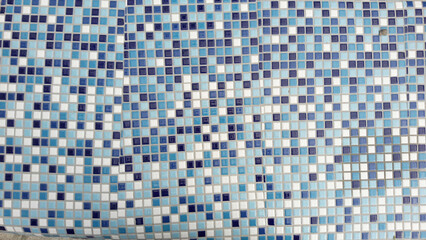 Mosaic square tiles with blue and white gradient. Square bricks, background texture. Tile wallpaper. natural surface weathering