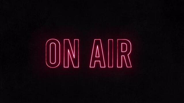 On air neon sign. Appearance animation. Radio live recording icon. Red tv studio signboard. Black blur background. Glow warning text. Modern motion graphic. 3d signage close up. Design banner symbol.