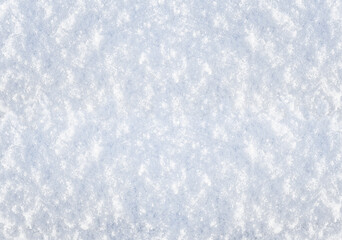 Winter background with snow patterns. Abstract background. The natural texture of snow. The surface...