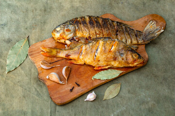 Fried appetizing fish on barbecue, picnic food close-up