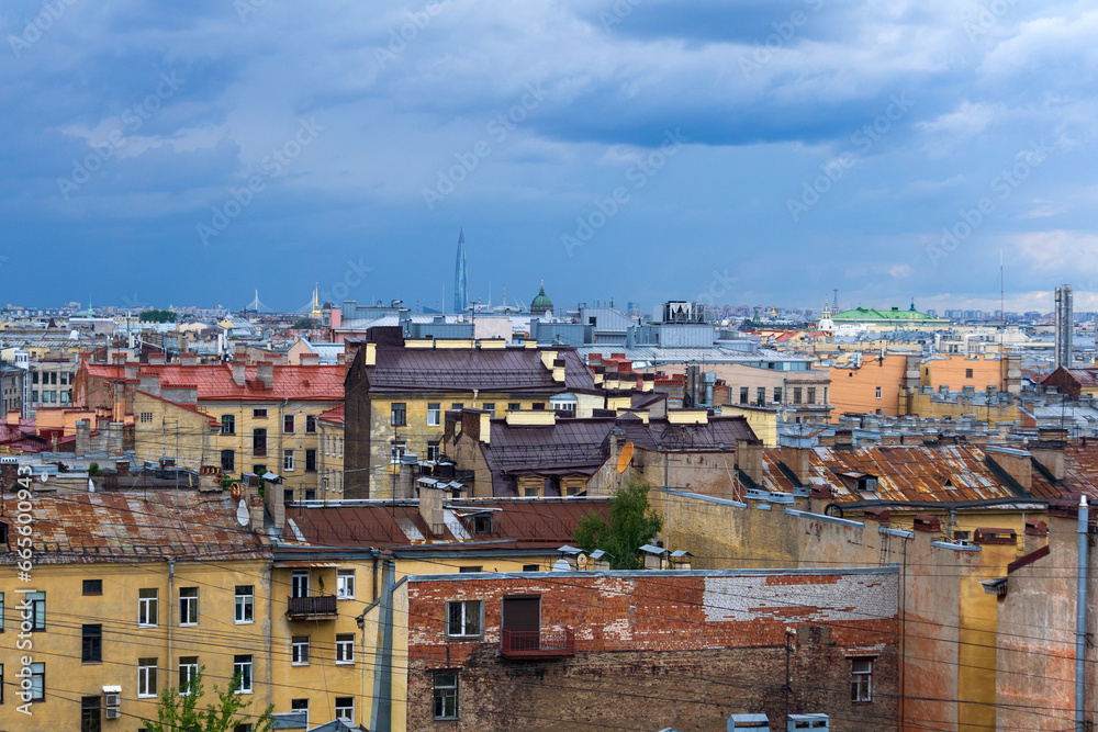 Wall mural top view of the city roofs in the historical center of Saint Petersburg before the onset of a thunderstorm