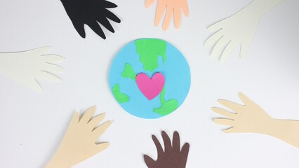 African american people together. Earth day postcard close up. Stop motion paper animation. Show love gesture. Racial unity concept. Black antiracism sign. Pink heart beat. Eco art card. Green globe.