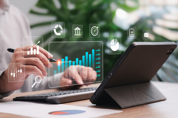 Business Analytics Data Management of finance work report concept, Businessman use tablets to show...
