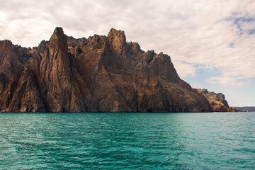 Fototapeta premium Beautiful view from the sea to the rocky coastline 