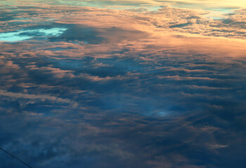 Sky landscape. Mesmerizing clouds on the background of sunset. Layered clouds.