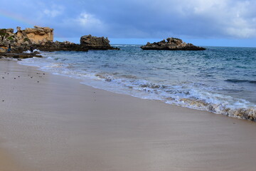 Rocky limestone formations on the coast and beaches of Point Peron Rockingham Western Australia. September 2022.