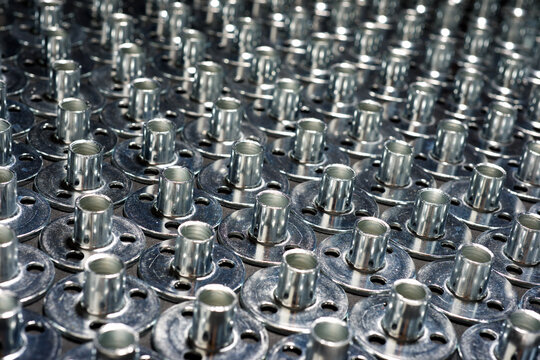 Tee nuts for fastening metal screws to wooden parts