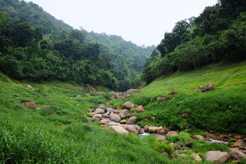 Fototapeta na wymiar Freshness landscape for water fall and Stream flowing through rocks in tropical rain forest and greenery wild jungle. Khao Chong Lom at Nakhonnayok province, Thailand